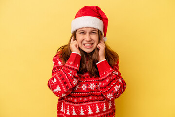 covering ears with hands.