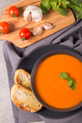 Tomato soup with basil.  Healthy, vegan and dieting lunch and dinner concept. Gazpacho. 