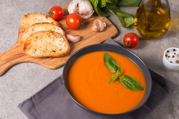 Tomato soup with basil.  Healthy, vegan and dieting lunch and dinner concept. Gazpacho. 