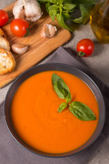 Tomato soup with basil.  Healthy, vegan and dieting lunch and dinner concept. Gazpacho. 