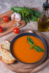 Tomato soup with basil.  Healthy, vegan and dieting lunch and dinner concept. Gazpacho. 