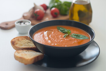 Tomato soup with basil.  Healthy, vegan and dieting lunch and dinner concept. Gazpacho. 