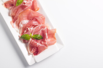 Closeup of thin slices of prosciutto. Italian food 