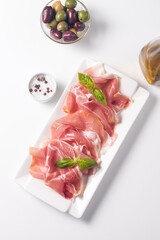 Closeup of thin slices of prosciutto. Italian food 