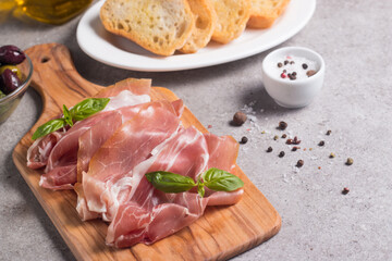 Closeup of thin slices of prosciutto. Italian food 