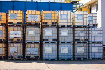 White square water tank. Water tank with a metal grate. White huge container for liquid