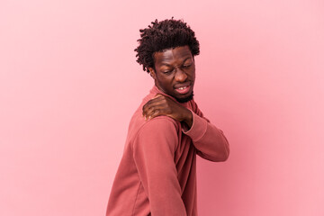 Young african american man isolated on pink background having a shoulder pain.