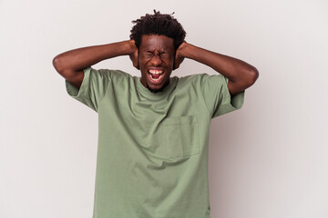 Young african american man isolated on white background  covering ears with hands trying not to hear too loud sound.
