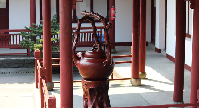 photograph of a teapot statue in a temple in china