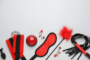 Sex toys and accessories on white background, flat lay. Space for text - obrazy, fototapety, plakaty