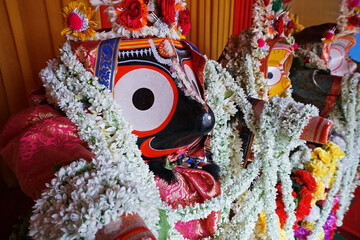 Idols of God Jagannath, Balaram and Goddess Suvadra. Lord Jagannath is being worshipped with...