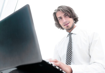 closeup.a successful employee working with a laptop