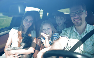 happy family rides in the car