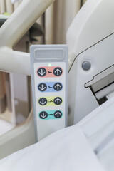 Closeup view of adjustable hospital bed control panel