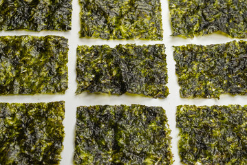 Tasty nori seaweed isolated on white.