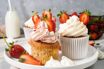 Strawberry muffins with cream and strawberries