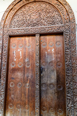 Traditional wooden door is a Stone town. Zanzibar, Tanzania
