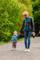 beautiful girl with a boy in the park on the background of the lake in the park