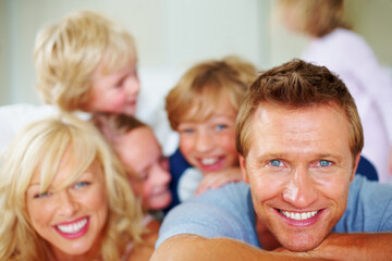 Happy mature man with his family enjoying together. Portrait of a happy mature man with his family enjoying together.