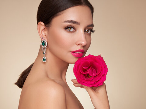 Portrait Beautiful Young Woman With Clean Fresh Skin. Model With Healthy Skin, Close Up Portrait. Cosmetology, Beauty And Spa. Girl With A Rose Flower