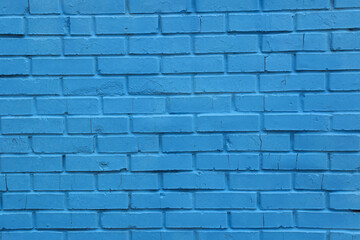 brick wall of the house painted in blue