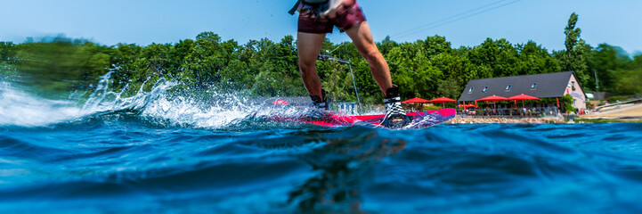 Cut out of athlete wakeboarding with motion blur
