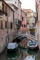 Fototapeta premium Narrow canal in the city of Venice on a summer day