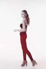 Simply beautiful. Full length shot of a gorgeous young woman standing in the studio.