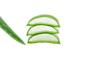 Small pieces of an aloe vera leaf forming a pile on a white background.