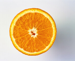 Top view on a cut in half of an orange on the light Gray background.