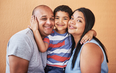 He is the glue in the family. Cropped shot of a cheerful young couple holding their son while...