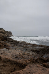 waves crashing on rocks