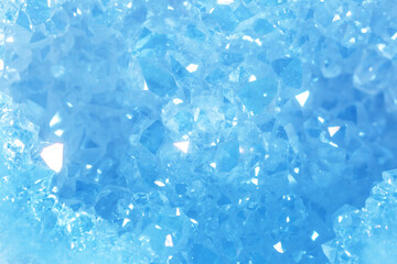 Blue Crystal Mineral Stone. Gems. Mineral crystals in the natural environment. Texture of precious and semiprecious stones. Seamless background with copy space colored shiny surface of precious stones