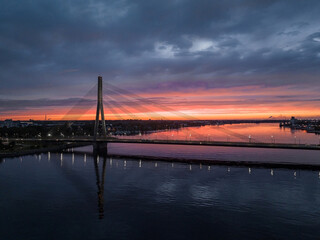 Bridge over river Daugava in Riga, Latvia during beautiful summer sunset.
