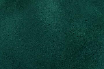 Green background from decorative plaster with abstract spots. Unusual green wall texture with beautiful patterns, creative surface background. Front covering for facing of buildings.
