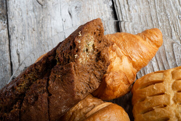 fresh french bakery  around old style background . close up . flat lay