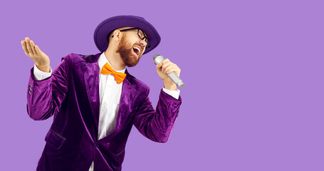 Funny emotional man holding microphone for karaoke and singing party songs on purple background....