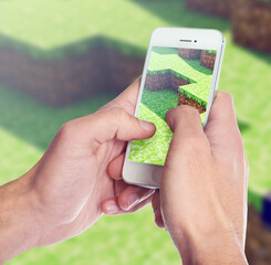 Closeup shot of somebody playing a popular video game on a smartphone. ALL design on this image is...