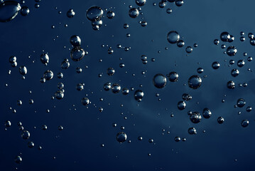 Close up macro Aloe vera gel serum cosmetic texture blue background with bubbles. Cruelty free. Lemongrass gel skincare product. antibacterial liquid with aloe vera, moisturizing.