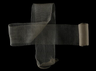  Medical bandage roll isolated on black 