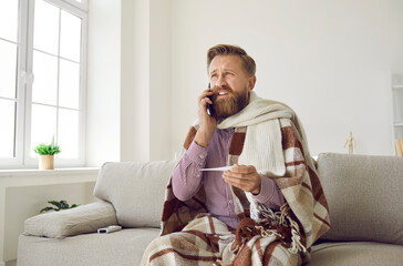 Not coming to work today. Man sitting on sofa in warm scarf and blanket, holding thermometer and making phone call to doctor. Worker who has flu and fever talking to boss and asking for sick leave