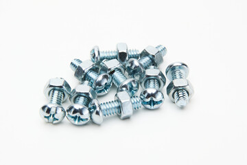 collection of screw bolts attached to hex nuts isolated in white 