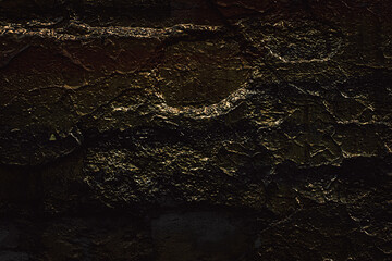 Brick brown Wall. Rock pile. Rock background. Rock texture. Stone background. Paint spots. Rock surface with cracks. Grunge Rough structure. Abstract texture.