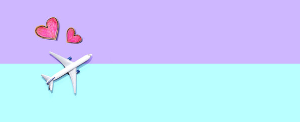 Flights booking and reservation theme with a toy airplane and hearts