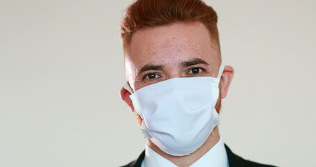 Person removing face mask after pandemic, man feeling relief