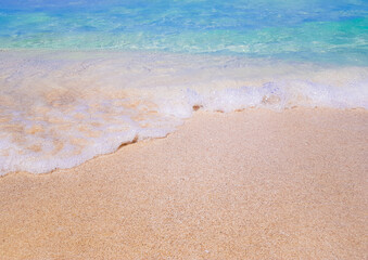 Background beach with sea wave. Texture sand. Gentle pastel colors. Vintage filter. Blue sky and azure coast, Es Trenc, Mallorca. Relax atmosphere.