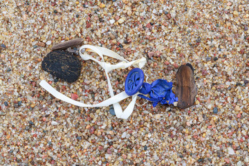 The Sad End of a Little Blue Balloon with a White Ribbon