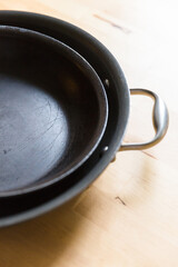 Well loved pans on a kitchen table.