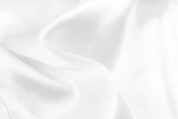 Plakat A twisted piece of white fabric. White material or texture with waves and folds. Wrinkled white fabric