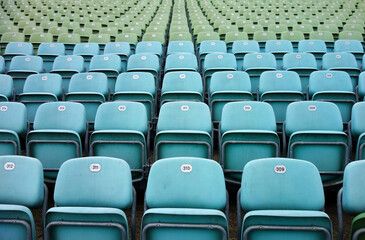 empty seats in a stadium, blue and green